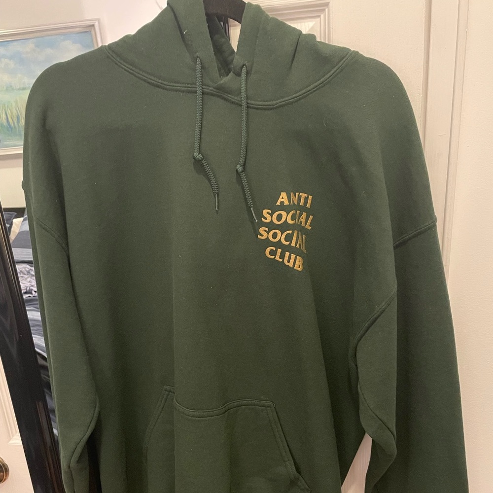 Green & gold Anti Social Social Club hoodie. Size L. Small hole shown.